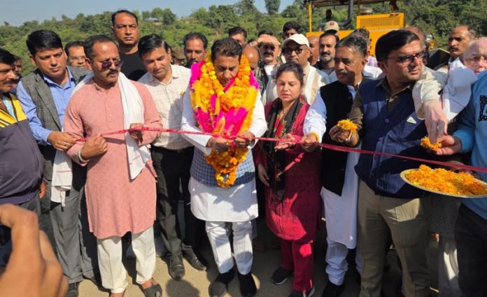 MLA Rajiv Jasrotia inaugurating blacktopping of Mangloor to Garh road in Jasrota constituency of Kathua district on Saturday. -Excelsior/Badyal
