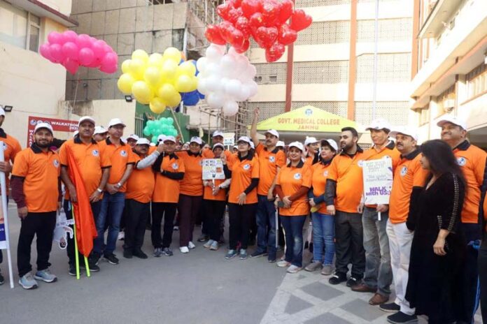Guests and participants during flagging off ceremony of walkathon at GMC Jammu.