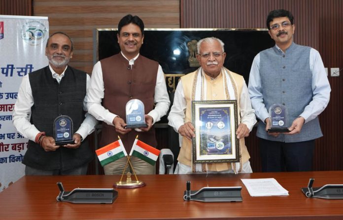 Union Minister Manohar Lal releasing a commemorative coin of Rs 50 during a function on Thursday. Union Minister Manohar Lal releasing a commemorative coin of Rs 50 during a function on Thursday.