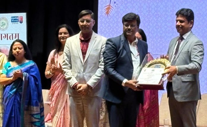 Vishal Anand, GM (I/c), Pakal Dul HEP receiving an award from CMD NHPC on Friday. Vishal Anand, GM (I/c), Pakal Dul HEP receiving an award from CMD NHPC on Friday.
