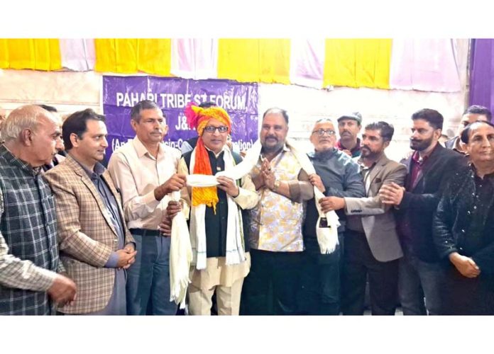 Vikrant Sharma honouring Bharat Bhushan Vaid on his election as President of Pahari Tribe ST Forum. Vikrant Sharma honouring Bharat Bhushan Vaid on his election as President of Pahari Tribe ST Forum.