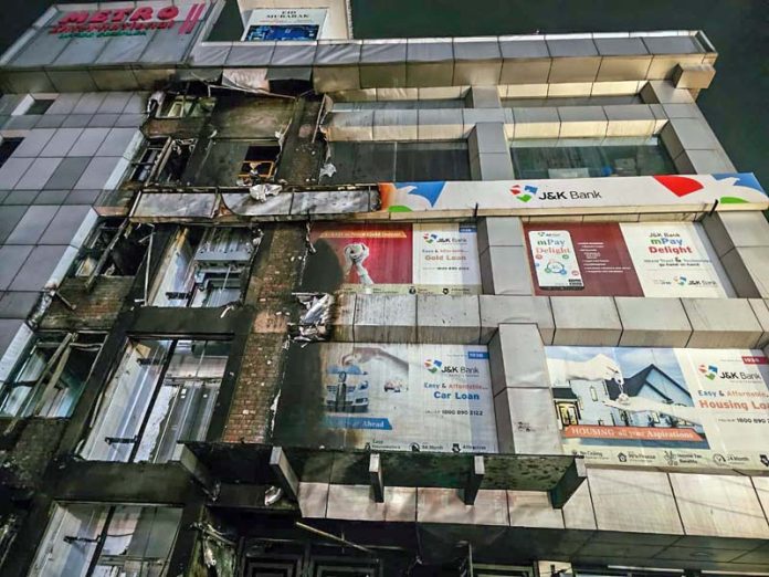 Damage caused by fire to a complex in Rajbagh area of Srinagar on Wednesday. -Excelsior/Shakeel