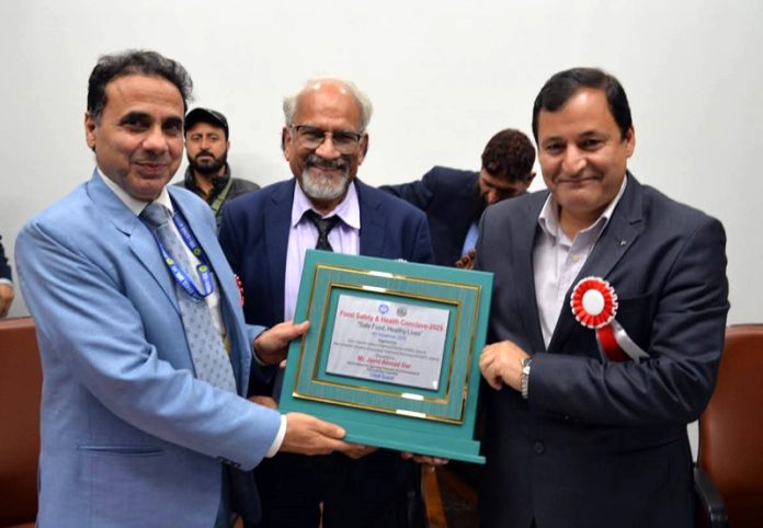 Minister Javid Ahmad Dar being presented memento during Food Safety & Health Conclave. Minister Javid Ahmad Dar being presented memento during Food Safety & Health Conclave.
