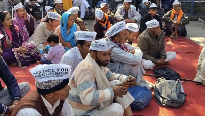 The irate people during a dharna and hunger strike in protest against alleged murder of three youth at Billawar on Monday. — Excelsior /Pardeep The irate people during a dharna and hunger strike in protest against alleged murder of three youth at Billawar on Monday. — Excelsior /Pardeep