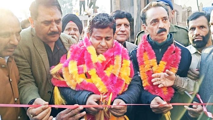 MLA Iftkhar Ahmed inaugurating a bore well in Rajouri.