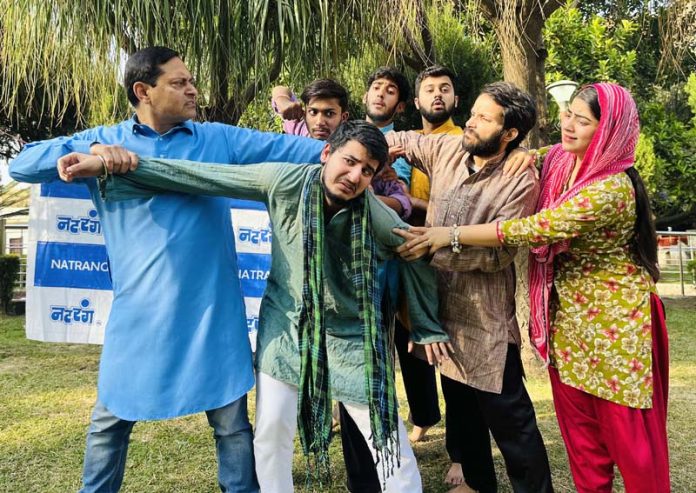 A scene from play ‘AAG’ staged by Natrang in Jammu.