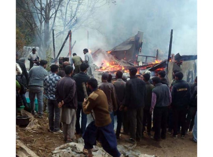 A residential house on fire at Keshwan area in Kishtwar on Thursday. -Excelsior/Ajay Shan