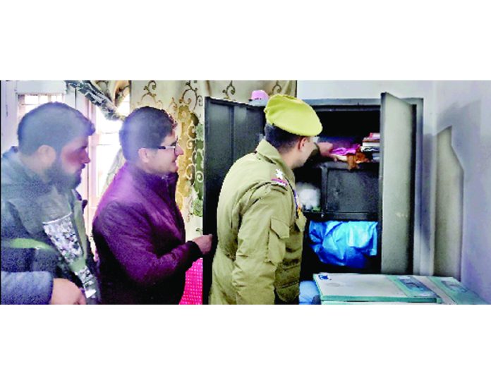 Locker of a doctor being checked in a hospital in Kulgam. - Excelsior/Sajad Dar