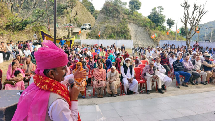 MLA Akhnoor, Mohan Lal Bhagat addresses a public gathering at Kotli Tanda near Akhnoor on Monday.