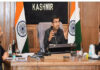 Div Com chairing a meeting of Handicarft and Handloom departments