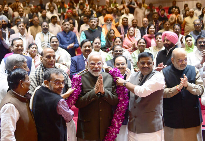 PM Narendra Modi being garlanded during the Parliamentary Party meeting, in New Delhi on Tuesday. (UNI) PM Narendra Modi being garlanded during the Parliamentary Party meeting, in New Delhi on Tuesday. (UNI)