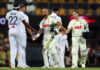 Australian players shaking hands with England players after beating them in 2nd test match at Brisbane.