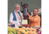 Prime Minister Narendra Modi being presented a memento by Uttar Pradesh Chief Minister Yogi Adityanath during the inauguration of Rashtra Prerna Sthal in Lucknow on Thursday. (UNI)