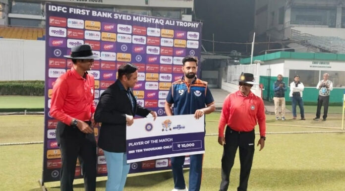 Player of match receiving cheque from dignitaries. Player of match receiving cheque from dignitaries.
