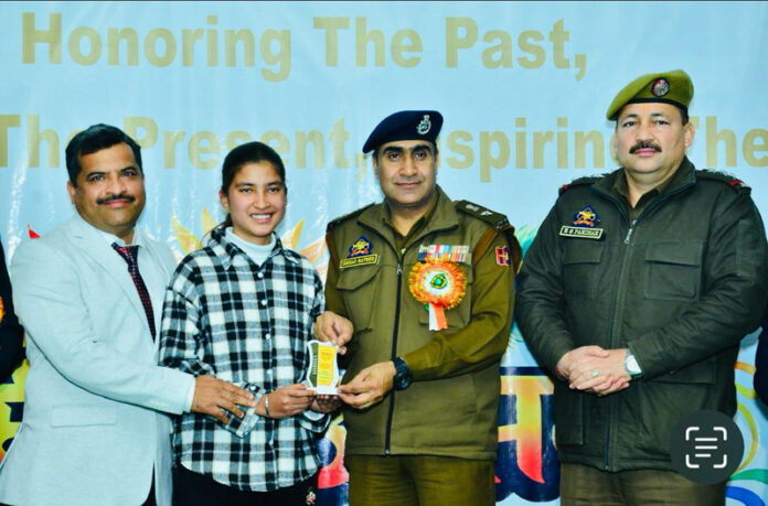 Police officer presenting award to a student.