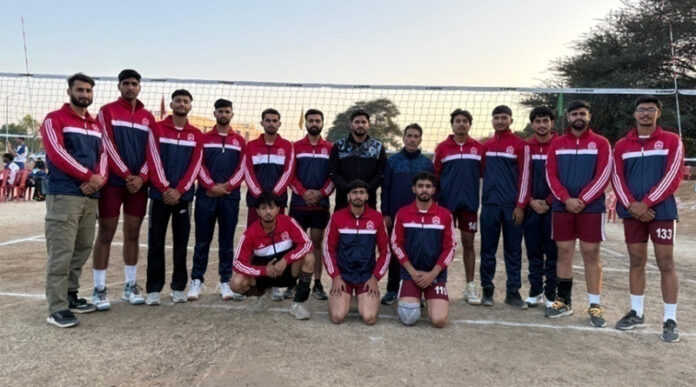 Volleyball players posing for a group photograph.