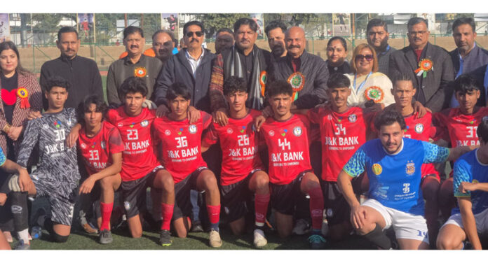 Dignitaries posing along with football teams during inaugural event of football tourney.