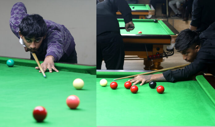 Ranveer Singh and Nikhil Matoo playing against each other during 29th Inter-District Billiards, Snooker Championship match on Tuesday. -Excelsior/Rakesh