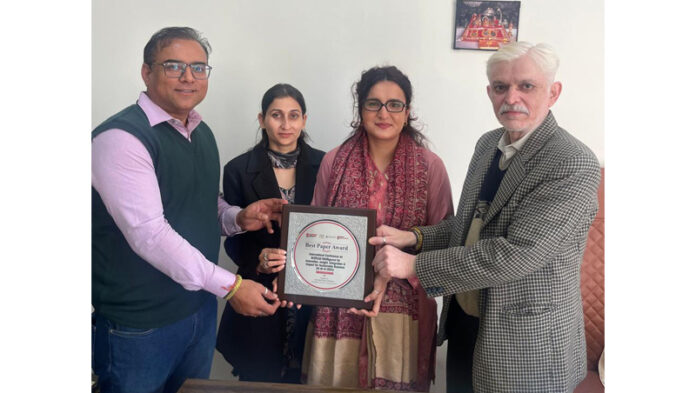 JU Scholars receiving Award from dignitaries at Chandigarh University.