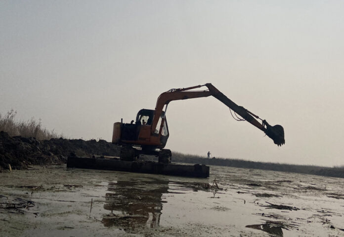 Restoration work underway at Shallbug wetland in Ganderbal district.