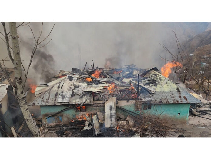 Two houses on fire in Mandi area of Poonch. -Excelsior/Waseem