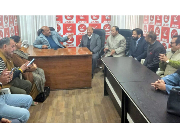 DyCM, Surinder Choudhary interacting with party functionaries during Public Darbar at NC office in Jammu on Saturday.