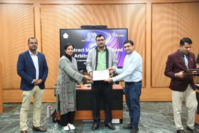 Participation certificates being presented on conclusion of training programme at IIM Jammu.