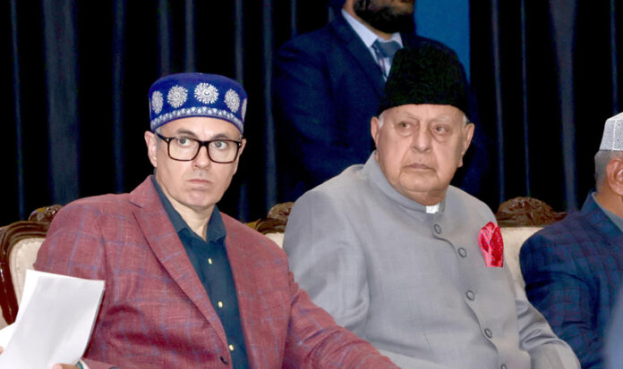 Dr Farooq Abdullah and Omar Abdullah at a function in Jammu on Tuesday.