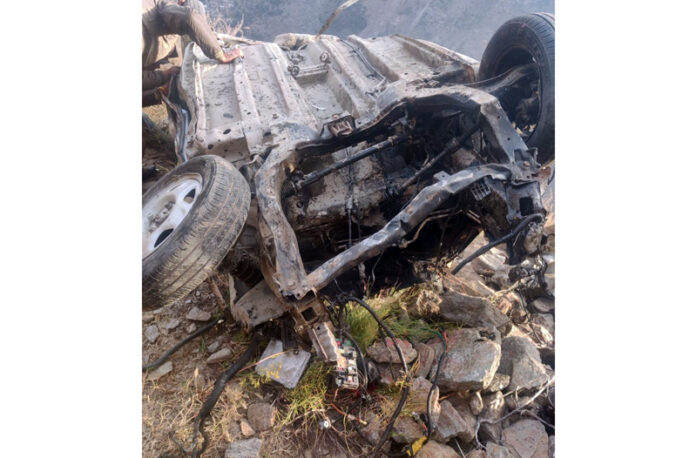 Mingled remains of a car which fell in a deep gorge in Kishtwar on Saturday. -Excelsior/Ajay Shan Mingled remains of a car which fell in a deep gorge in Kishtwar on Saturday. -Excelsior/Ajay Shan