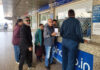 Passengers wait outside the ticket counter after several flights were cancelled at Jammu Airport on Saturday.