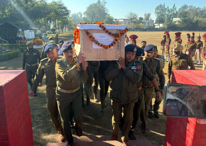 DGP Nalin Prabhat and IGP Bhim Sen Tuti lend shoulders to martyr Amjad Ali Khan at Udhampur on Tuesday.
