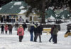 Tourists enjoy fresh snowfall in Gulmarg. -Excelsior/Aabid Nabi