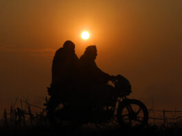 Couple rides on a motor-cycle during cold and foggy Sunday morning, on the outskirts of Jammu. - Excelsior/Rakesh
