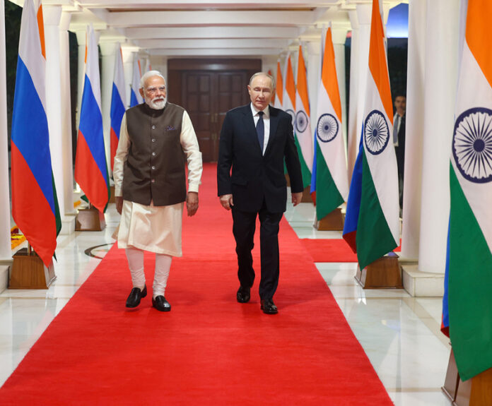 PM Narendra Modi along with Russian President Valadimir Putin at Lok Kalyan Marg in New Delhi on Thursday.