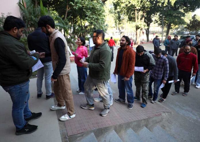 Candidates outside an examination centre in Jammu district. -Excelsior/Rakesh