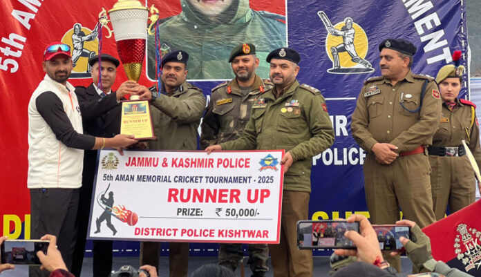 SSP Kishtwar Naresh Singh presenting runners-up trophy and cash prize to captain of Bhaderkashi cricket team. - Excelsior/Tilak Raj