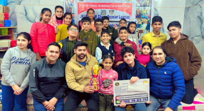 Winners posing along with dignitary during prize distribution ceremony.