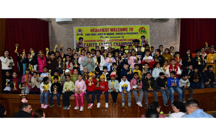 Students posing along with dignitaries during a programme.