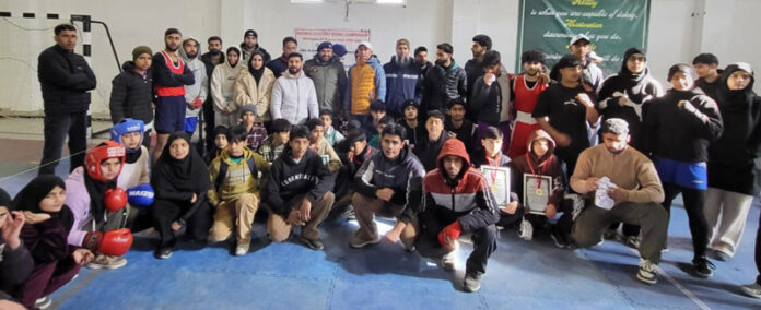 Winners posing along with medals and dignitaries.