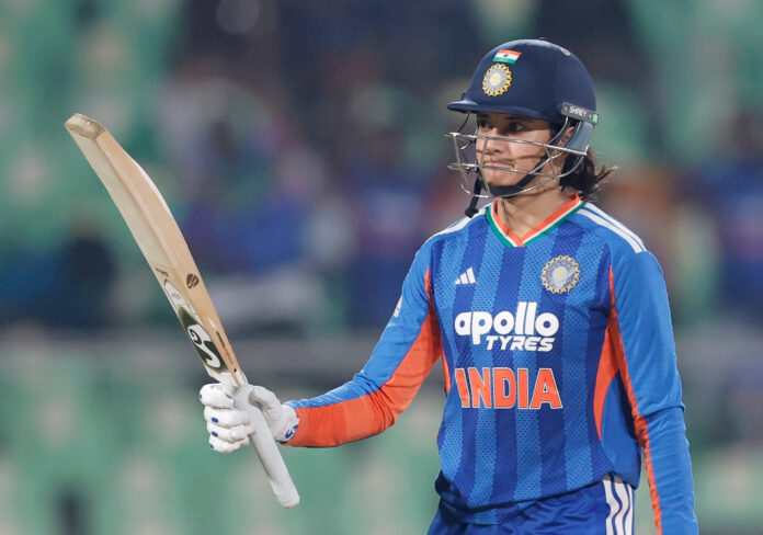 Smriti Mandhana raising her bat after scoring 80 runs against Sri Lanka in Thiruvananthapuram on Sunday.