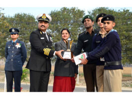 Cadets receiving trophy from dignitaries.