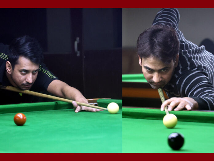 Adnan Lone and Younis Kuchey in action during Snooker match at MA Stadium, Jammu. -Excelsior/Rakesh