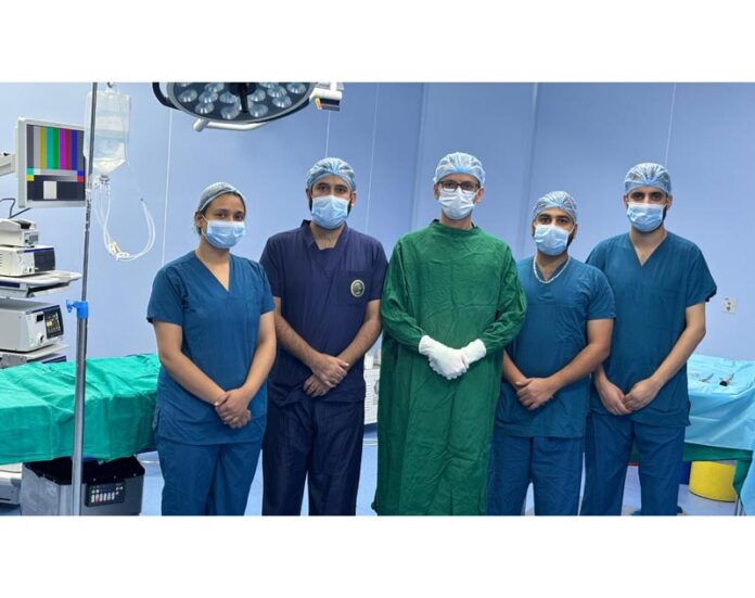 A team of urologists posing together after performing an advanced endourological procedure at AIIMS Jammu.