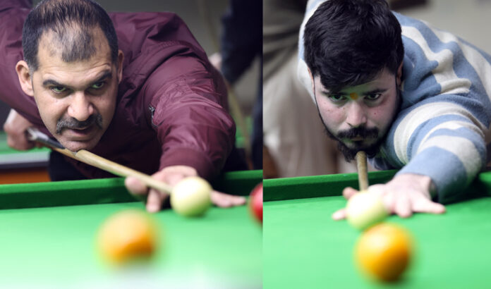 Cueists in action at the 29th J&K UT Billiards and Snooker Championship being held at MA Stadium, Jammu. -Excelsior/Rakesh