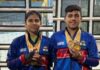 Tamanna Saini and Puneesh Puri posing along with medals.