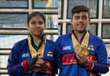 Tamanna Saini and Puneesh Puri posing along with medals.