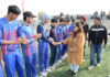 Dignitary interacting with players before start of match.