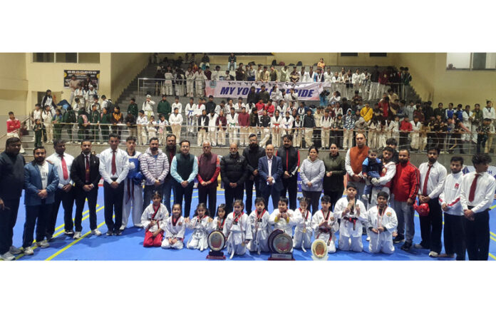 Winners posing along with dignitaries during closing ceremony.