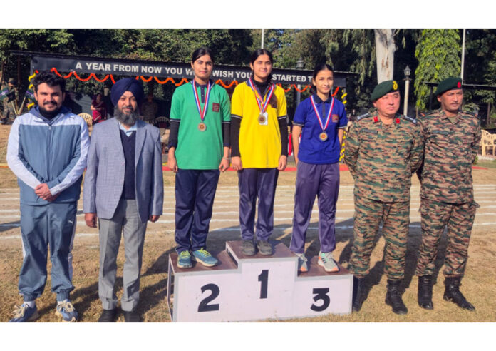 Winners posing on podium along with medals and dignitaries. Winners posing on podium along with medals and dignitaries.