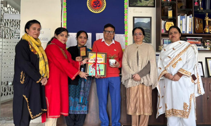 Senior journalist Raju Kerni posing with Principal and teachers of Jammu Sanskriti School, Jammu.